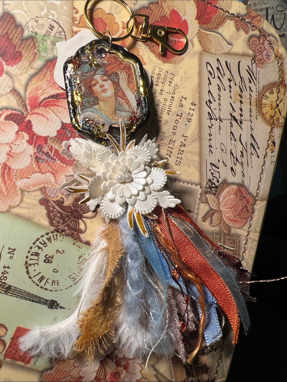 Hand Crafted White Floral Boho Tassel Keychain with Blue and Rust Ribbons